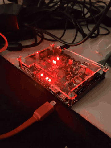 The ALINX AX7020 on the bench with the four PL LEDs blinking, the open-toolchain blinky loaded through the REST API
