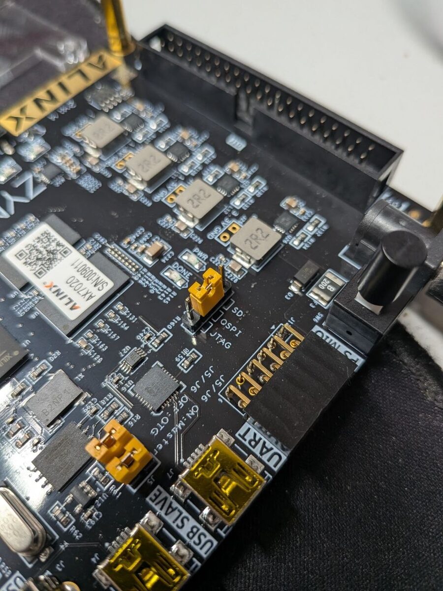Boot-mode header J13 with the jumper on the QSPI position