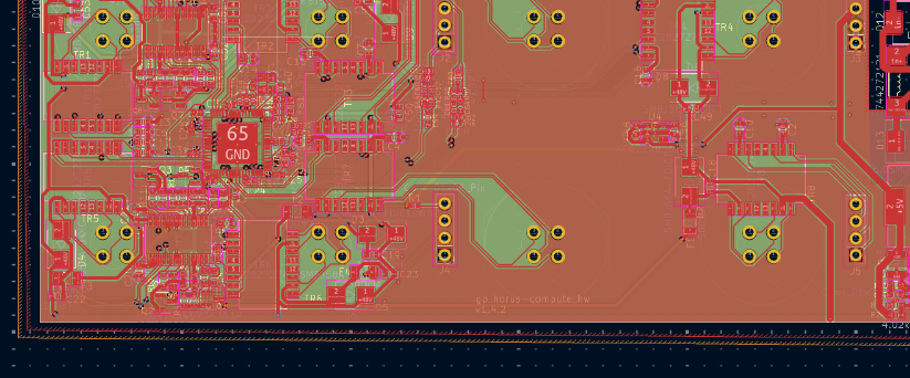 PCB layout view showing dense copper routing, vias, and component placement: a constraint-satisfaction problem of a different order than schematic capture
