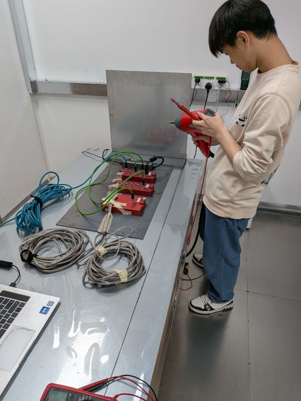 Setup in progress — the NTC technician preparing the conducted immunity test