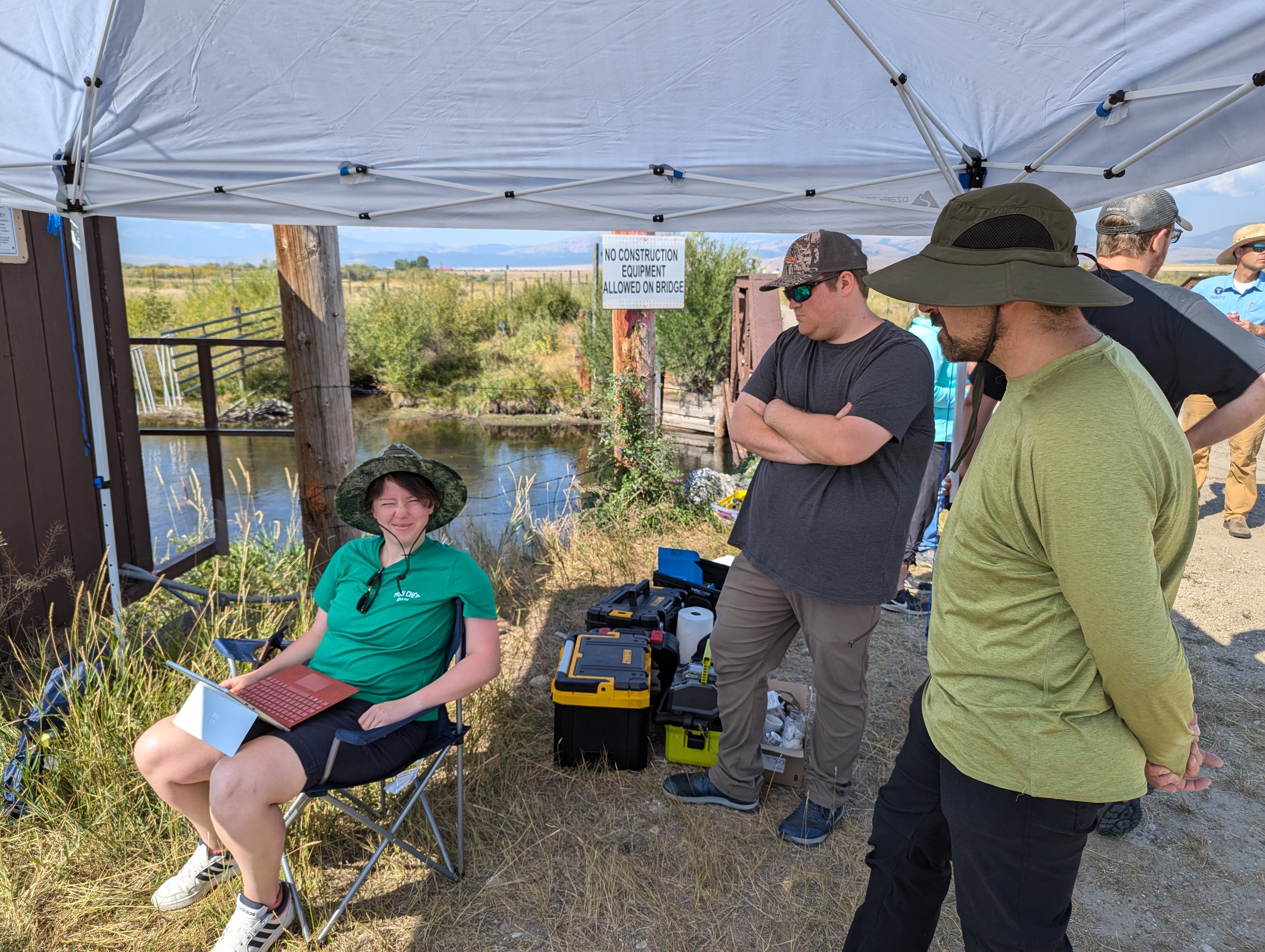 Field command centre — reviewing progress under the canopy