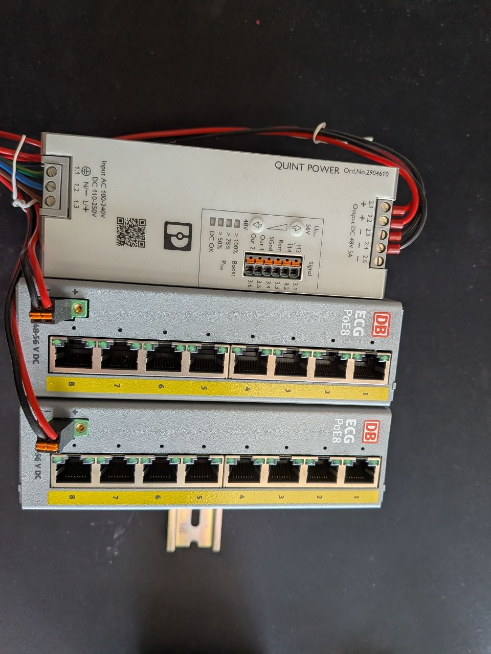 Custom-developed PoE infrastructure for the switching stations: QUINT POWER 48V supply feeding two DB ECG PoE8 DIN-rail switches — built because the right hardware simply didn't exist yet.